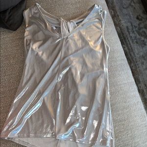 A chrome silver top with a unique back